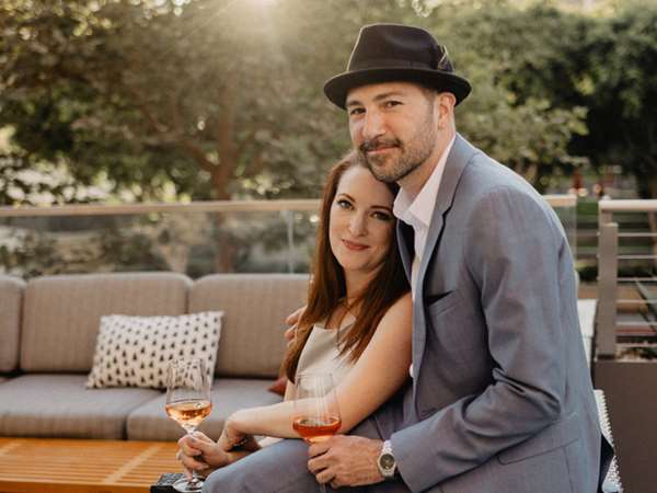 happy couple drinking rose wine. 