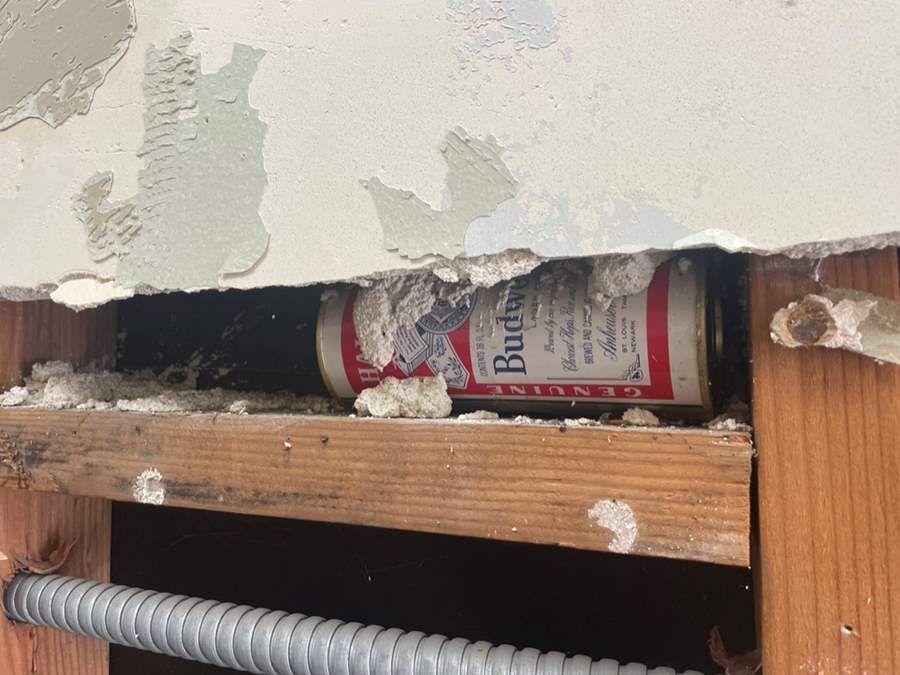 Antique Beer can in wall 